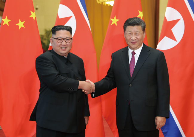 지난 6월 19일 김정은 북한 국무위원장이 시진핑 중국 국가주석과 베이징 인민대회당에서 올해 들어 세 번째 북·중 정상회담을 갖고 있다. ⓒphoto 뉴시스
