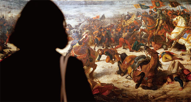파리 루브르박물관에서 들라크루아의 그림을 감상하고 있는 여행객. ⓒphoto 뉴시스