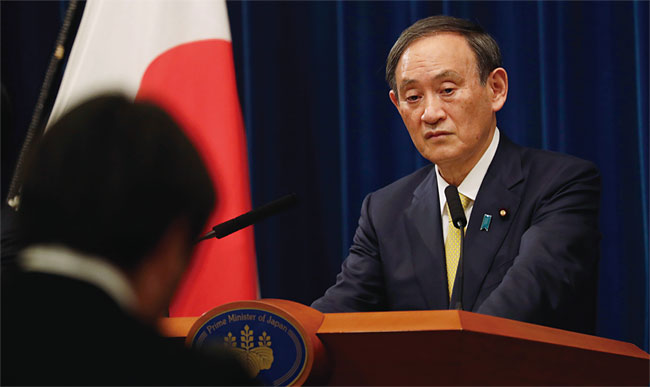 지난해 12월 4일 스가 일본 총리가 기자회견에서 성공적인 올림픽 개최를 다짐하고 있다. ⓒphoto 뉴시스
