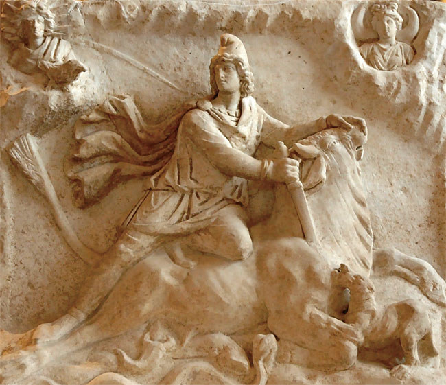 파리 루브르박물관에 있는 미트라스 신 부조. 고깔모자를 쓴 미트라스 신이 칼로 소의 목을 찌르고 있다. ⓒphoto 위키피디아