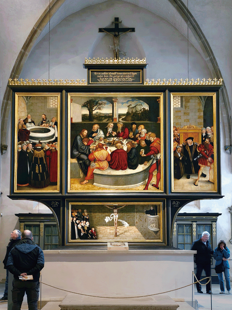 비텐베르크 시립교회에 있는 제단화 4장. ‘오직 믿음, 오직 은총, 오직 말씀’이라는 개신교 가르침을 가장 잘 요약했다고 한다. 모두 루카스 크라나흐가 그렸다.